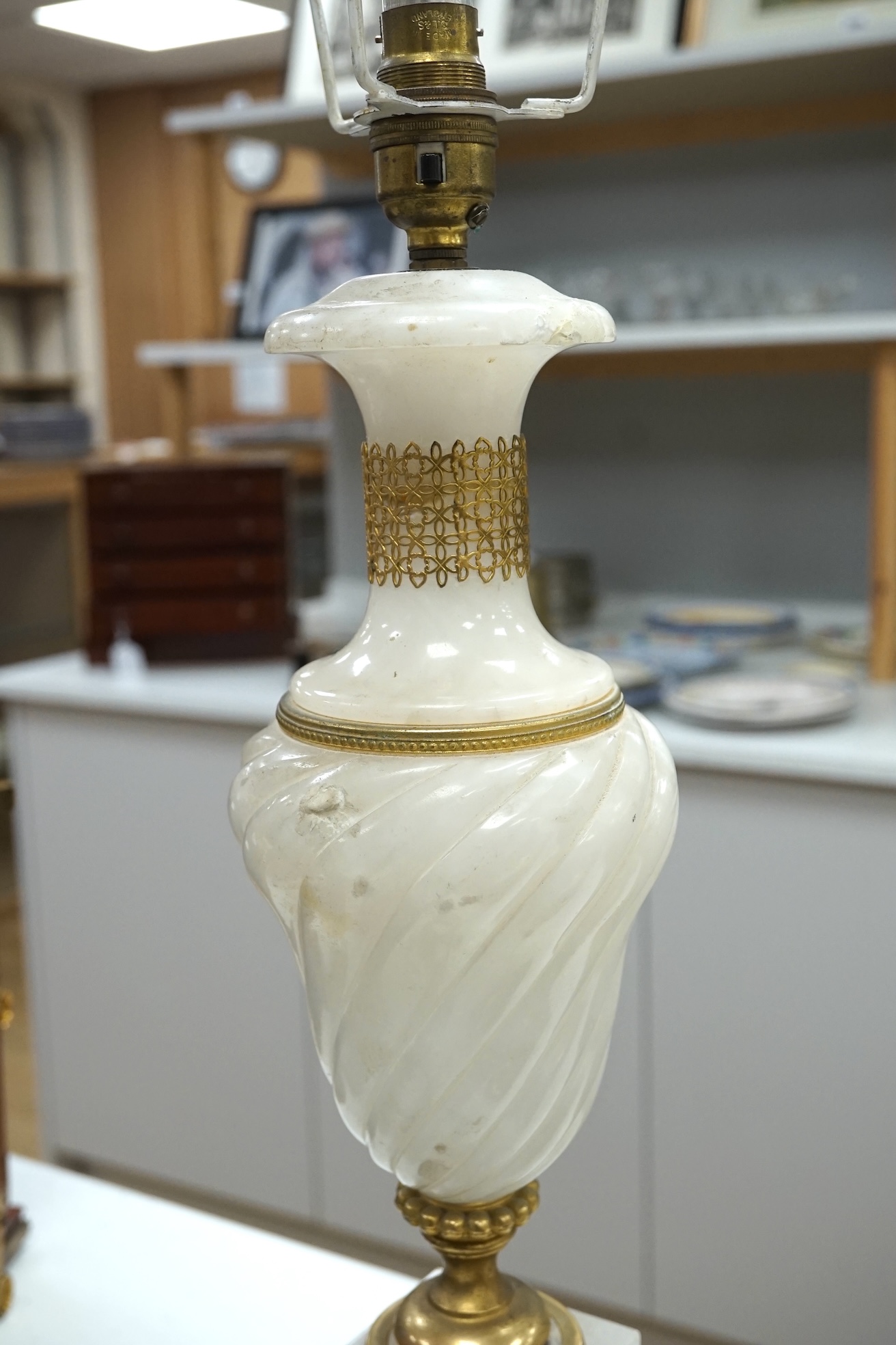 An alabaster and gilt table lamp, 44cm to top of alabaster. Condition - fair